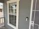 Secure front door with security features, framed by a window, in a well maintained home at 201 S Greenfield S Rd # 222, Mesa, AZ 85206