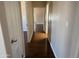 Hallway shows smooth wood floors and doorways into the bedrooms and bathrooms at 201 S Greenfield S Rd # 222, Mesa, AZ 85206