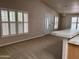 Spacious living room featuring carpet, and plantation shutters, perfect for entertaining or relaxation at 201 S Greenfield S Rd # 222, Mesa, AZ 85206