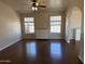 Spacious living room boasts wood floors, natural light, and a ceiling fan at 201 S Greenfield S Rd # 222, Mesa, AZ 85206