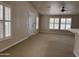 Light-filled living area with carpet, vaulted ceilings, and plantation shutters, offers comfortable living space at 201 S Greenfield S Rd # 222, Mesa, AZ 85206
