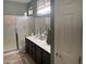 Bathroom featuring a shower, double sinks with modern fixtures, and a towel bar at 20376 N Coronado Way, Surprise, AZ 85374
