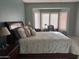 Spacious bedroom featuring a large bed, side tables, and comfortable natural lighting at 20376 N Coronado Way, Surprise, AZ 85374