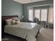 Comfortable bedroom featuring a serene setting, a window desk area, and soft natural lighting at 20376 N Coronado Way, Surprise, AZ 85374