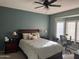 Inviting bedroom with a ceiling fan and a window desk area for comfortable work and relaxation at 20376 N Coronado Way, Surprise, AZ 85374