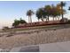 Welcome to The Grand, showcasing a beautifully landscaped entrance with lush greenery and vibrant flowers at 20376 N Coronado Way, Surprise, AZ 85374