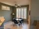 Bright dining area featuring a ceiling fan, neutral decor, and abundant natural light at 20376 N Coronado Way, Surprise, AZ 85374