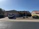 Charming single-story home with a two-car garage and desert landscaping at 20376 N Coronado Way, Surprise, AZ 85374