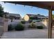 Covered patio overlooking a well-maintained yard and neighboring houses at 20376 N Coronado Way, Surprise, AZ 85374