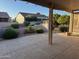 Relaxing covered patio with views of the landscaped backyard and nearby residences at 20376 N Coronado Way, Surprise, AZ 85374