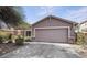 Inviting single-story home with a two-car garage and well-maintained landscaping at 21570 N Greenway Rd, Maricopa, AZ 85138