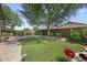 The well-maintained backyard boasts lush greenery and a beautiful landscape design, ideal for relaxation at 2226 W Periwinkle Way, Chandler, AZ 85248