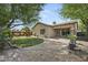 An inviting outdoor space with manicured landscaping and a spacious patio area, perfect for entertaining at 2226 W Periwinkle Way, Chandler, AZ 85248