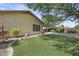 A serene backyard featuring a meticulously designed layout, complemented by elegant patio features at 2226 W Periwinkle Way, Chandler, AZ 85248
