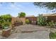 Landscaped backyard with brick pavers, retaining wall, plantings and desert landscaping at 2226 W Periwinkle Way, Chandler, AZ 85248
