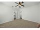 Empty bedroom with walk-in closet, neutral paint and ceiling fan at 2226 W Periwinkle Way, Chandler, AZ 85248