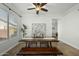 Bright dining area featuring a wooden table, modern seating, and neutral color palette, perfect for gatherings at 2226 W Periwinkle Way, Chandler, AZ 85248