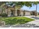 Beautiful single-story home with stone accents and a three-car garage on a well-maintained lawn at 2226 W Periwinkle Way, Chandler, AZ 85248