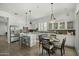Open concept kitchen features a center island, stainless steel appliances, breakfast nook, and modern cabinetry at 2226 W Periwinkle Way, Chandler, AZ 85248