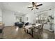 Open-concept living and dining area featuring neutral decor and warm tile floors at 2226 W Periwinkle Way, Chandler, AZ 85248