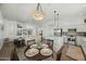Open floor plan connecting the breakfast nook, kitchen, and living room for modern, seamless living at 2226 W Periwinkle Way, Chandler, AZ 85248