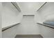 Walk-in closet with multiple shelves and hanging rods at 2226 W Periwinkle Way, Chandler, AZ 85248