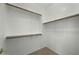 Spacious walk-in closet with neutral carpet and shelf and rod closet system at 2226 W Periwinkle Way, Chandler, AZ 85248
