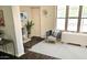 Cozy living room featuring a chair near a bright window and white walls, creating a serene space at 227 N Morris --, Mesa, AZ 85201