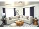 Bright living room boasts a cozy sectional sofa, stylish decor, and natural light at 227 N Morris --, Mesa, AZ 85201