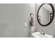 Bathroom features a round mirror, a towel and a sink at 2302 E Paraiso Dr, Phoenix, AZ 85024