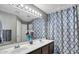 Bathroom features a double vanity and a decorative shower curtain at 2302 E Paraiso Dr, Phoenix, AZ 85024