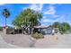 Desert-landscaped home with an attached garage, xeriscaping, and a drought-tolerant landscape at 2302 E Paraiso Dr, Phoenix, AZ 85024