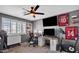 Home office showcasing the desk setup, dual monitors and the exercise bike at 2302 E Paraiso Dr, Phoenix, AZ 85024