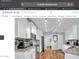 Bright kitchen featuring white cabinetry, granite countertops, stainless steel appliances, and wooden floors at 2302 E Paraiso Dr, Phoenix, AZ 85024