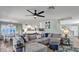 Comfortable living room space with plush seating, adjacent to an open-concept kitchen and dining area at 2302 E Paraiso Dr, Phoenix, AZ 85024