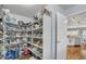 Spacious walk-in pantry featuring ample shelving for organized storage and easy access at 2302 E Paraiso Dr, Phoenix, AZ 85024