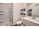 Tidy bathroom with shower, floating shelves, vanity, sink, and medicine cabinet at 23139 E Via Del Sol --, Queen Creek, AZ 85142