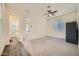 Cozy bedroom with a ceiling fan and lots of natural light, featuring neutral walls and carpeted flooring at 23139 E Via Del Sol --, Queen Creek, AZ 85142