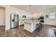 Modern kitchen with a large island, granite countertops, stainless steel appliances, and ample cabinet space at 23139 E Via Del Sol --, Queen Creek, AZ 85142