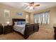 Serene bedroom with a comfortable bed, soft lighting, and neutral décor at 291 E Canyon Rock Rd, San Tan Valley, AZ 85143