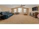 Bonus room with a vaulted ceiling, lots of natural light, and comfortable seating at 291 E Canyon Rock Rd, San Tan Valley, AZ 85143