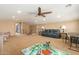 Spacious bonus room with a ceiling fan and comfortable seating area at 291 E Canyon Rock Rd, San Tan Valley, AZ 85143