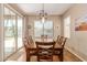 Bright dining area with sliding glass doors, allowing natural light and easy patio access at 291 E Canyon Rock Rd, San Tan Valley, AZ 85143