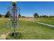Scenic disc golf course with lush green grass and a clear blue sky at 291 E Canyon Rock Rd, San Tan Valley, AZ 85143