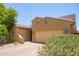 Charming single-story home with a two-car garage and desert landscaping at 291 E Canyon Rock Rd, San Tan Valley, AZ 85143