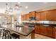 Well-equipped kitchen showcasing a large island, sleek countertops, and ample cabinet space at 291 E Canyon Rock Rd, San Tan Valley, AZ 85143