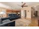 Open-concept living room with seating, and an adjacent kitchen, ideal for entertaining at 291 E Canyon Rock Rd, San Tan Valley, AZ 85143