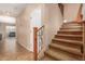 Carpeted staircase featuring wooden banister and decorative wrought iron at 291 E Canyon Rock Rd, San Tan Valley, AZ 85143