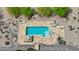 Aerial shot of a backyard pool with travertine tile and desert landscaping at 29619 N 142Nd Pl, Scottsdale, AZ 85262