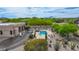 Aerial view of a property with a pool, desert landscaping, and a spacious layout, showcasing the outdoor living space at 29619 N 142Nd Pl, Scottsdale, AZ 85262